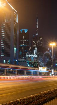 Dubai,UAE - 05.18.2021 Main road of a United Arab Emirates, Shekh Zayed road.Many of famous buildings can be seen as well as metro station and Museum of future.