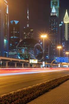 Dubai,UAE - 05.18.2021 Main road of a United Arab Emirates, Shekh Zayed road.Many of famous buildings can be seen as well as metro station and Museum of future.