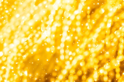 Golden Christmas lights, New Years Eve fireworks and abstract texture concept - Glamorous gold shiny glow and glitter, luxury holiday background