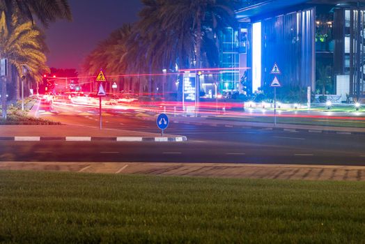 Night street with light trails from the cars.