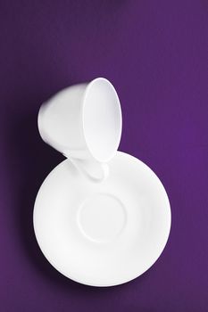 Kitchen, table decor and drinks menu concept - White tableware crockery set, empty cup on purple flatlay background