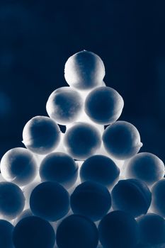 snowballs heap on dark blue background