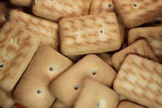 Close up top view of of biscuit cookies. Close up view rectangular biscuits with small pores