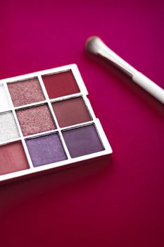 Cosmetic branding, mua and girly concept - Eyeshadow palette and make-up brush on cherry background, eye shadows cosmetics product for luxury beauty brand promotion and holiday fashion blog design