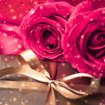 Celebration, holiday season and love concept - Valentines day present, luxury gift box and bouquet of roses with shiny snow