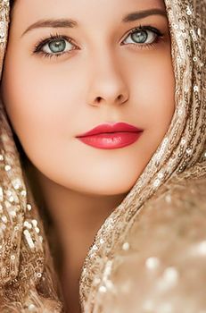 Beauty, luxury fashion and glamour, woman dressed in gold, portrait