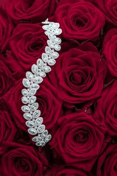 Luxe branding, glamour fashion and boutique shopping concept - Luxury diamond jewelry bracelet and red roses flowers, love gift on Valentines Day and jewellery brand holiday background design