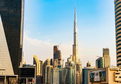 Dubai, UAE - 01.19.2021 - Burj Khalifa, tallest building in the world surrounded by other modern buildings