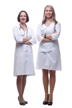 in full growth. two female doctor and Intern standing together . isolated on a white background.