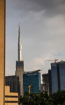 Dubai, UAE - 01.19.2021 - Burj Khalifa, tallest building in the world surrounded by other modern buildings