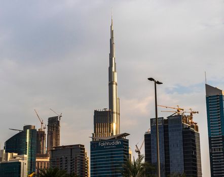 Dubai, UAE - 01.19.2021 - Burj Khalifa, tallest building in the world surrounded by other modern buildings