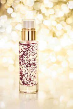 Cosmetic branding, blank label and glamour present concept - Holiday make-up base gel, serum emulsion, lotion bottle and golden glitter, luxury skin and body care cosmetics for beauty brand ads