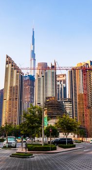 Dubai, UAE - 08.04.2021 - Burj Khalifa, tallest building in the world surrounded by other modern buildings