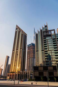 Dubai, UAE - 08.04.2021 - Burj Khalifa, tallest building in the world surrounded by other modern buildings