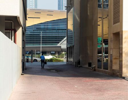 Person passing trough buildings