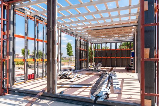 Metal frame of newly built building. Construction of a new tiny house