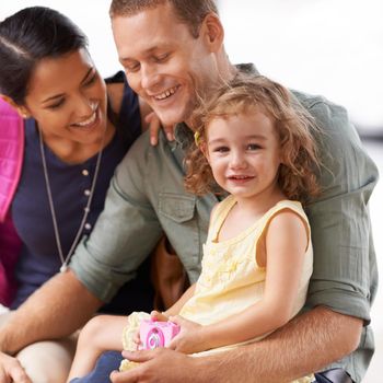 She was ready for her first adventure. A cropped shot of a contented family sitting outside