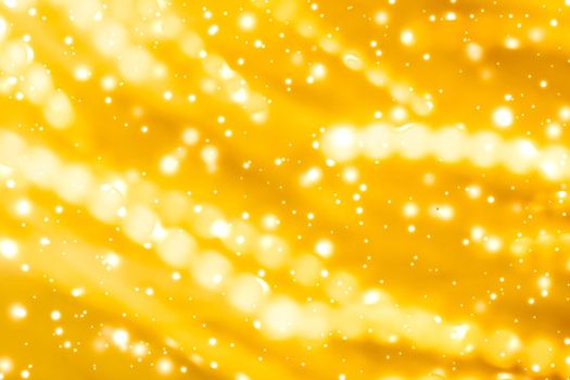 Golden Christmas lights, New Years Eve fireworks and abstract texture concept - Glamorous gold shiny glow and glitter, luxury holiday background