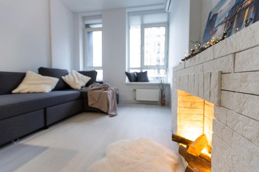 Bright living room interior with fireplace.