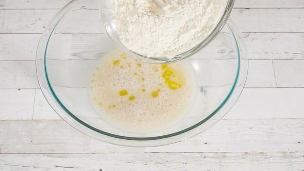 Preparing homemade pizza dough from all-purpose flour.