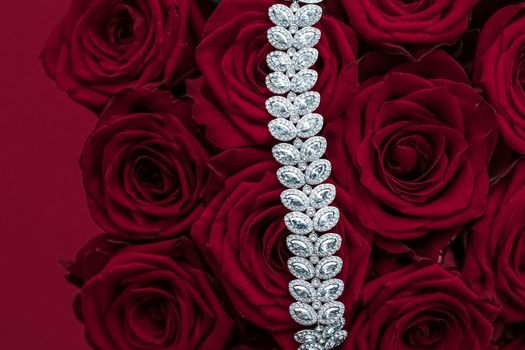 Luxe branding, glamour fashion and boutique shopping concept - Luxury diamond jewelry bracelet and red roses flowers, love gift on Valentines Day and jewellery brand holiday background design