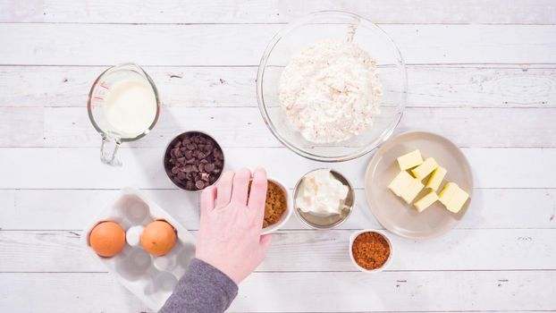 Flat lay. Ingredients to bake chocolate raspberry cupcakes.