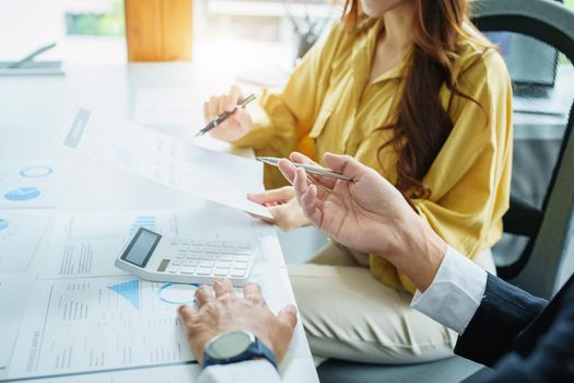 Portrait of a female business owner and partner company meeting to collaborate to invest in imported goods, plan to increase marketing profits using budget documents and working calculator.