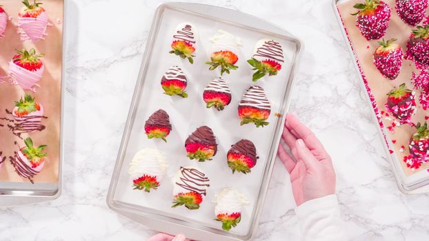 Flat lay. Step by step. Variety of chocolate dipped strawberries on a parchment paper.