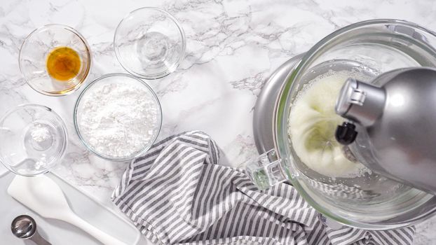 Step by step. Flat lay. Making meringue in kitchen mixer to bake unicorn meringue cookies.