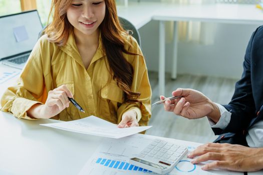Portrait of a female business owner and partner company meeting to collaborate to invest in imported goods, plan to increase marketing profits using budget documents and working calculator.