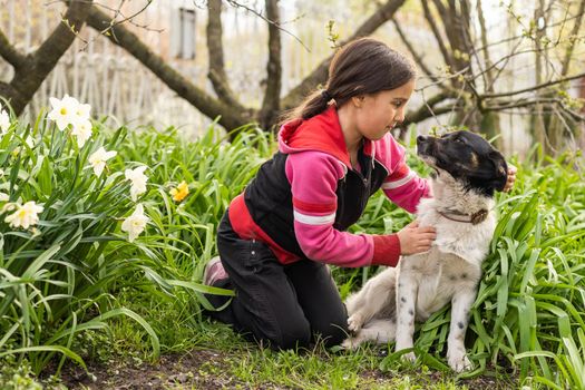 happy child girl with her dog.