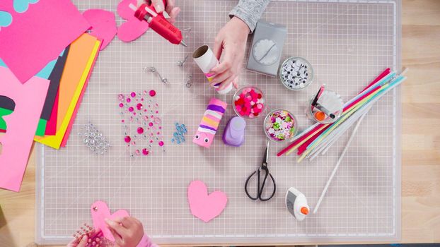 Flat lay. Kids papercraft. Making paper bugs out of the empty toilet paper rolls and construction paper.