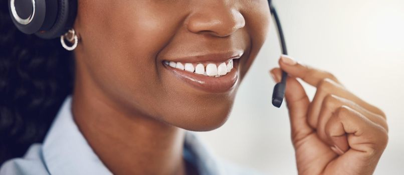 Smile, call center and mouth of black woman with headphone microphone for telemarketing, communication and customer support. Consultant, receptionist or customer service employee on phone call.