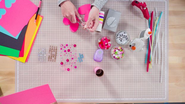 Flat lay. Kids papercraft. Making paper bugs out of the empty toilet paper rolls and construction paper.