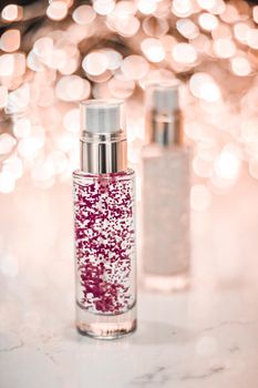 Cosmetic branding, blank label and glamour present concept - Holiday make-up base gel, serum emulsion, lotion bottle and rose gold glitter, luxury skin and body care cosmetics for beauty brand ads