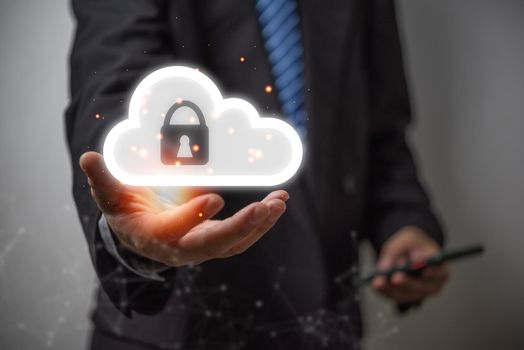 Businessmen Cloud security lock cyber is a key safe device protection of important devices upload backup data privacy database.concept of data theft prevention.