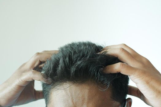 men Scratching Head Against white background