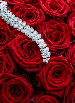 Gemstone jewellery, wedding fashion and luxe shopping concept - Luxury diamond bracelet and bouquet of red roses, jewelry love gift on Valentines Day and romantic holidays present