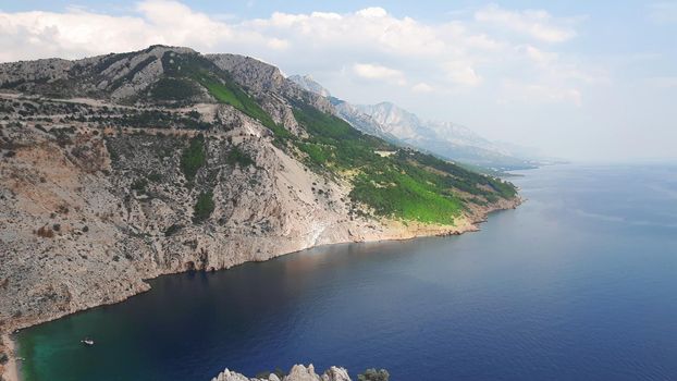Adriatic sea and mountains with beautiful sky and clouds. High quality photo