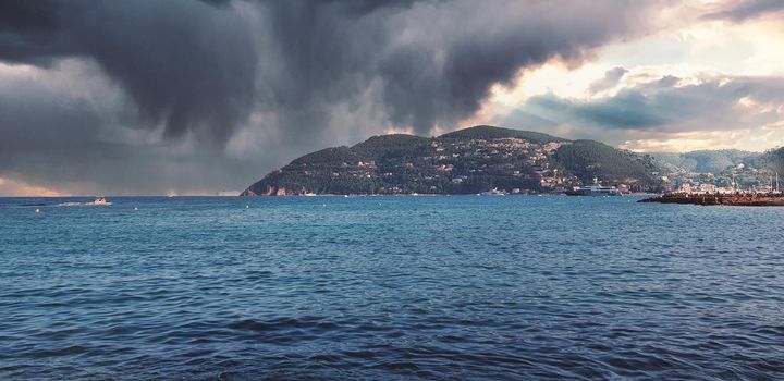 Storm clouds and island, storm Passing over the ocean, dramatic clouds. High quality photo