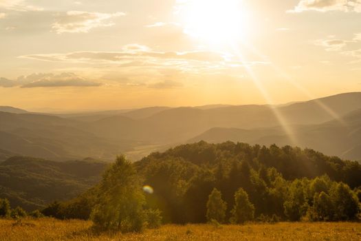 Sunset in mountains in summer landscape.