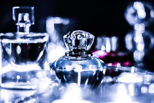 Perfumery, cosmetics branding and luxe concept - Perfume bottle and vintage fragrance on glamour vanity table at night, pearls jewellery and eau de parfum as holiday gift, luxury beauty brand present