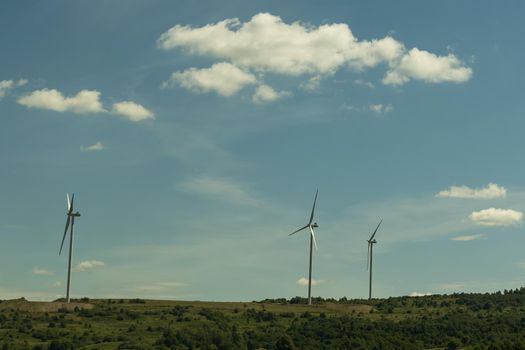 Power of wind turbine generating electricity clean energy with cloud background on the sky. Global ecology