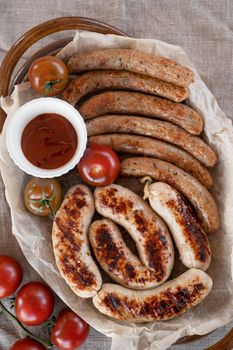 Grilled sausages with sauce and vegetables. Summer rest concept