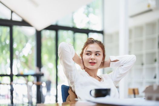 Portrait of a young employee showing a smile and a relaxed expression after work