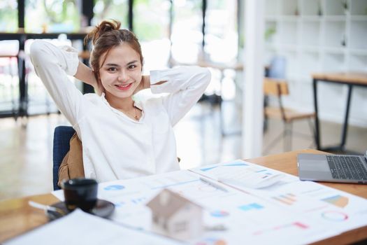 Portrait of a young employee showing a smile and a relaxed expression after work