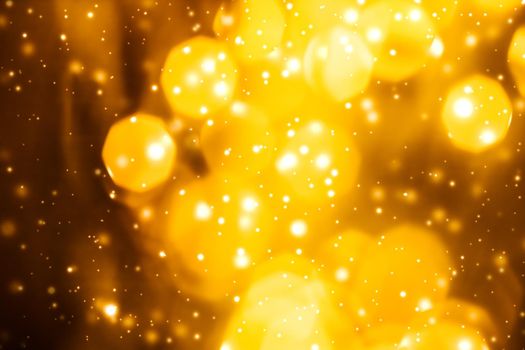 Golden Christmas lights, New Years Eve fireworks and abstract texture concept - Glamorous gold shiny glow and glitter, luxury holiday background