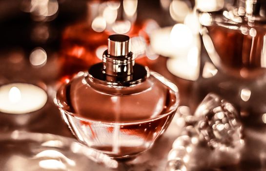 Perfumery, cosmetics branding and luxe concept - Perfume bottle and vintage fragrance on glamour vanity table at night, pearls jewellery and eau de parfum as holiday gift, luxury beauty brand present