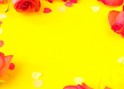 red roses flowers on yellow background, copy space. Banner , springtime concept, flyer, invitation traditional. template for designers. mockup. card with a rose petals and hearts on yellow background