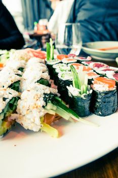 Food, travel and healthy eating concept - Japanese sushi in a restaurant at lunch time, asian cuisine